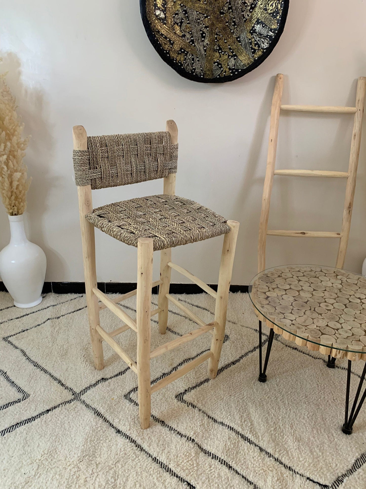 a chair and a stool in a room