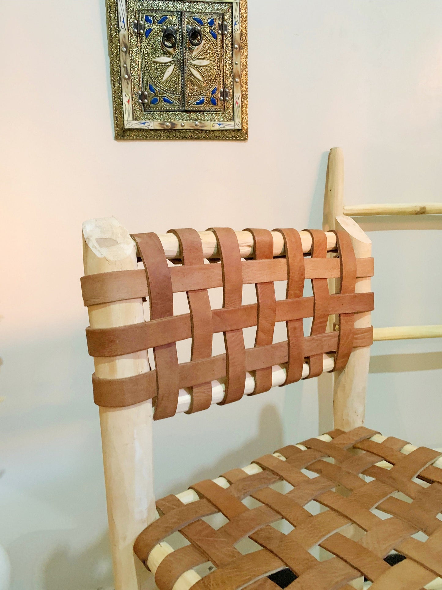 a wooden chair with a woven seat and back