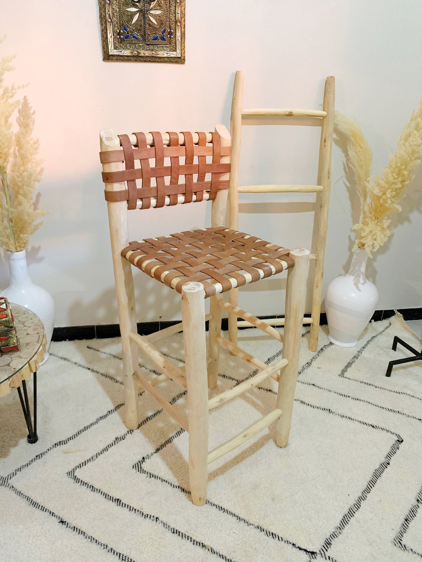 a wooden chair sitting on top of a white rug