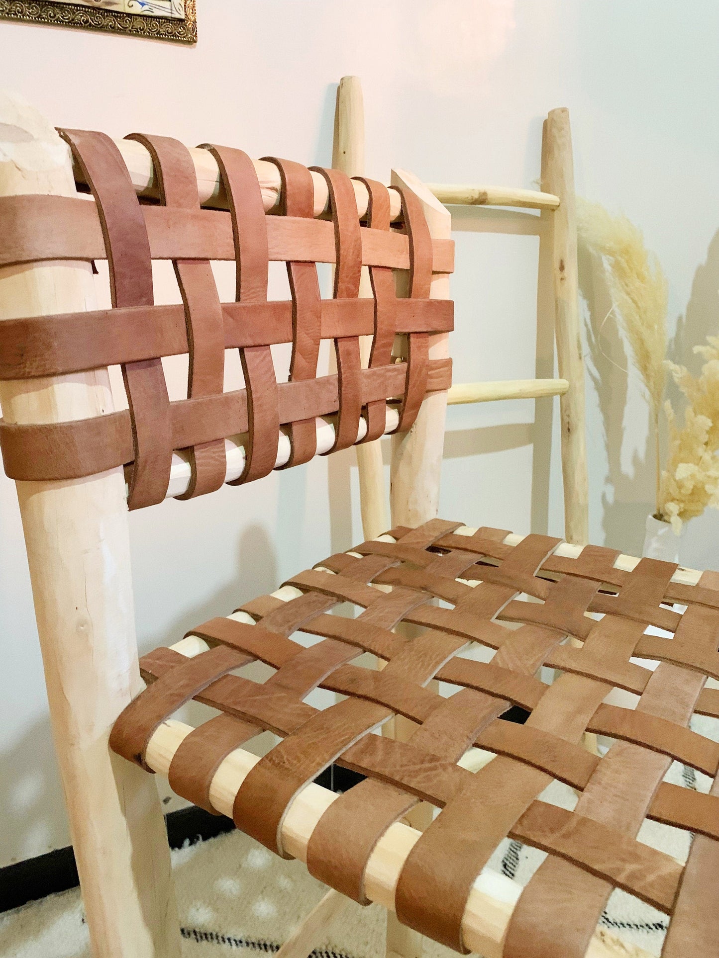 a wooden chair with a woven seat and back