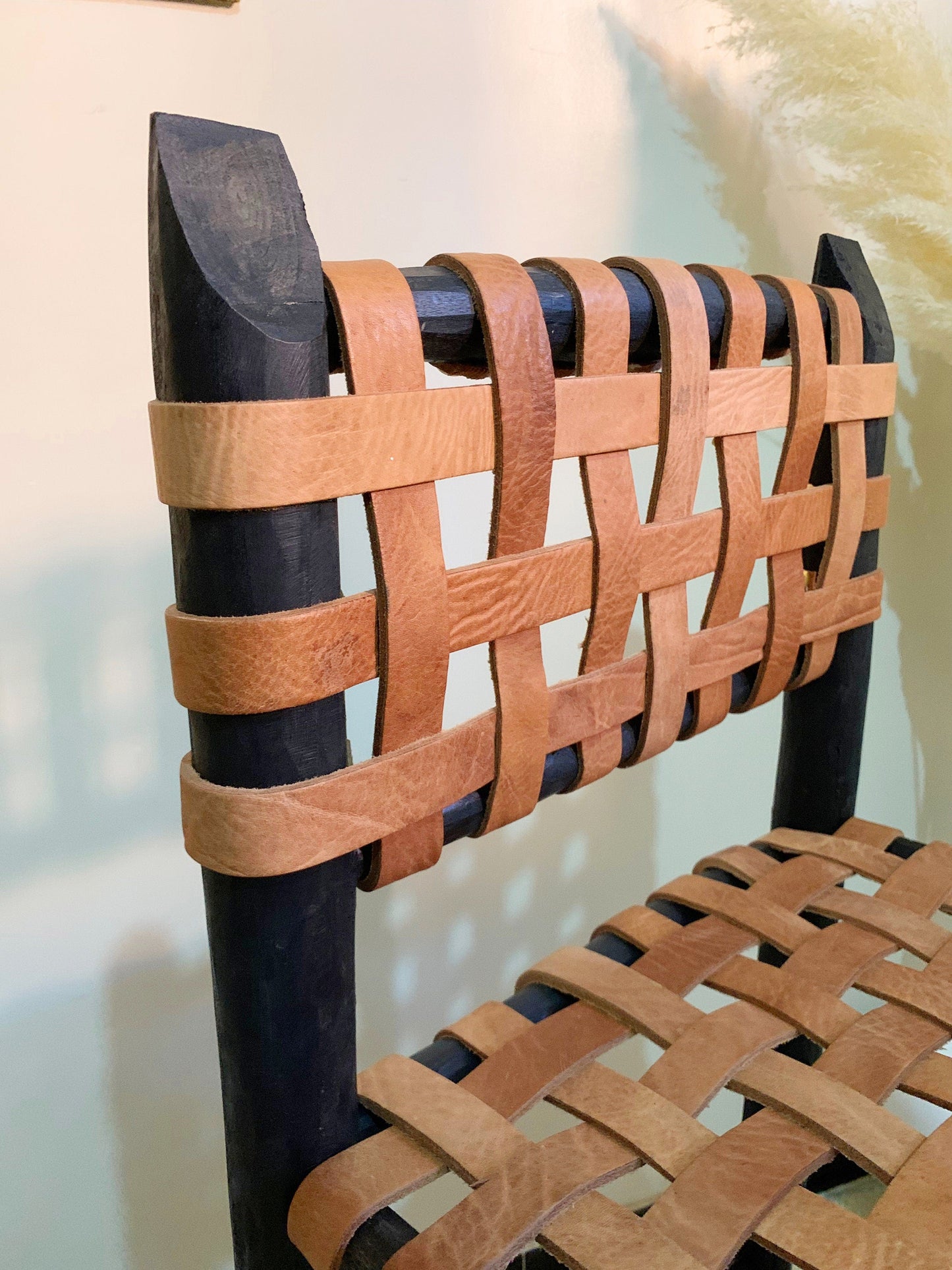 a close up of a chair made out of wood