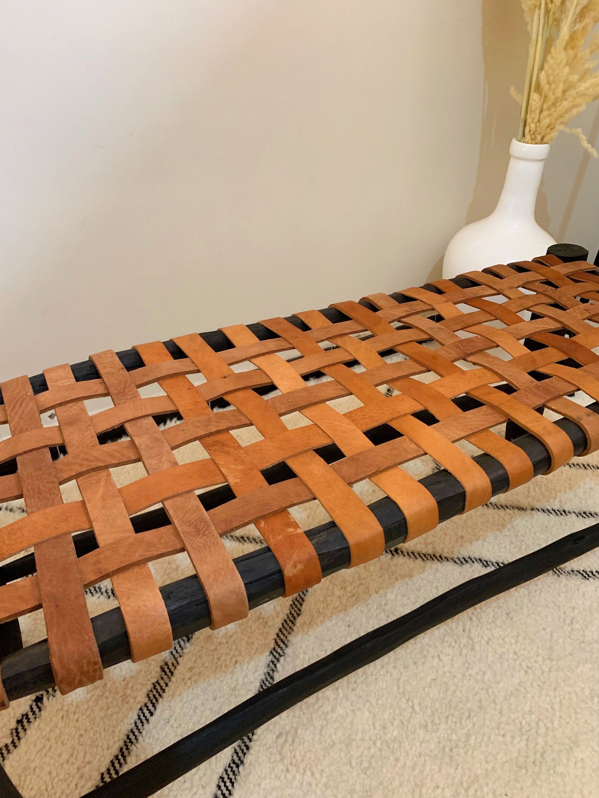 a wooden bench made out of strips of wood