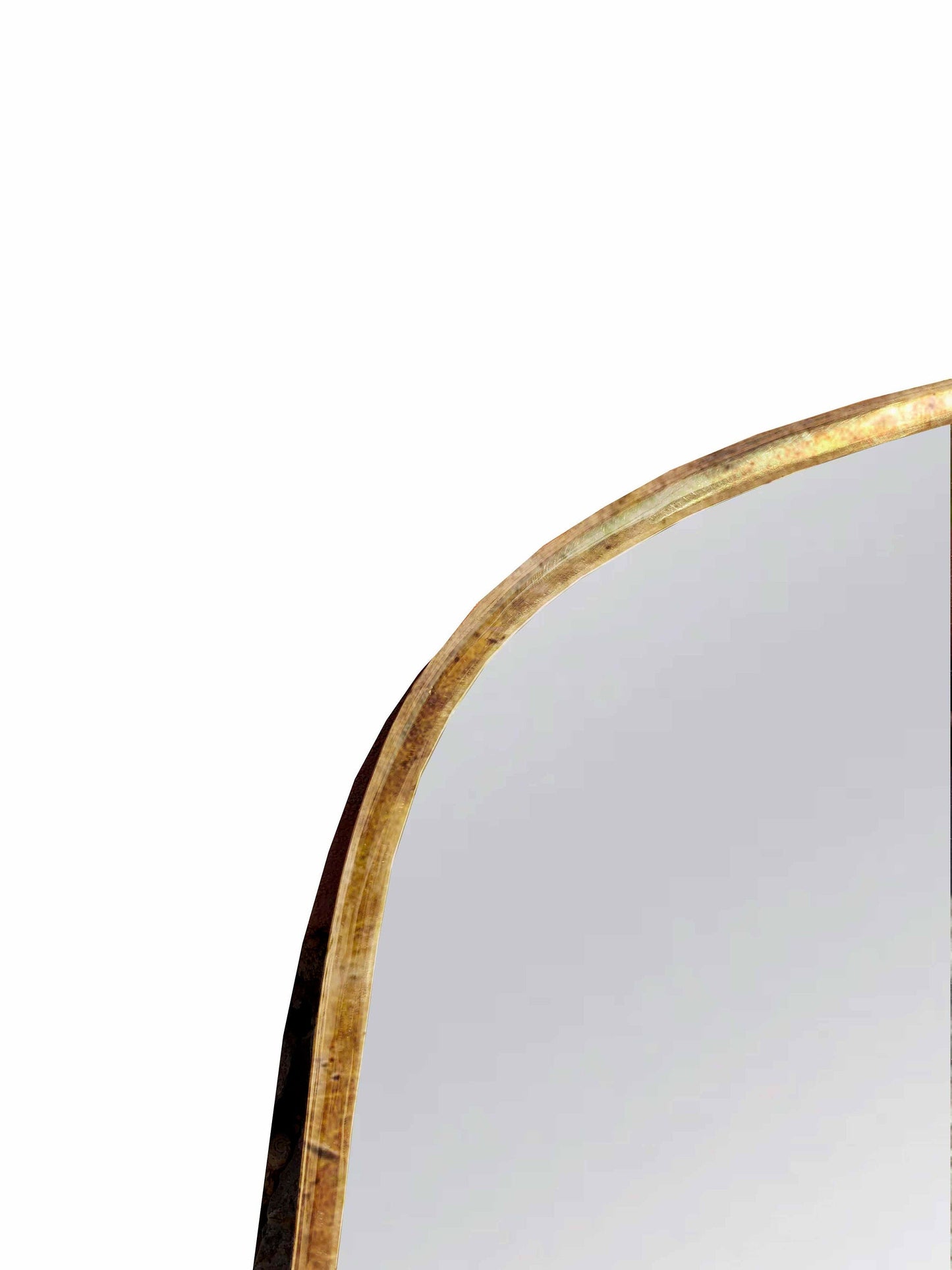 a mirror with a curved edge and a gold frame